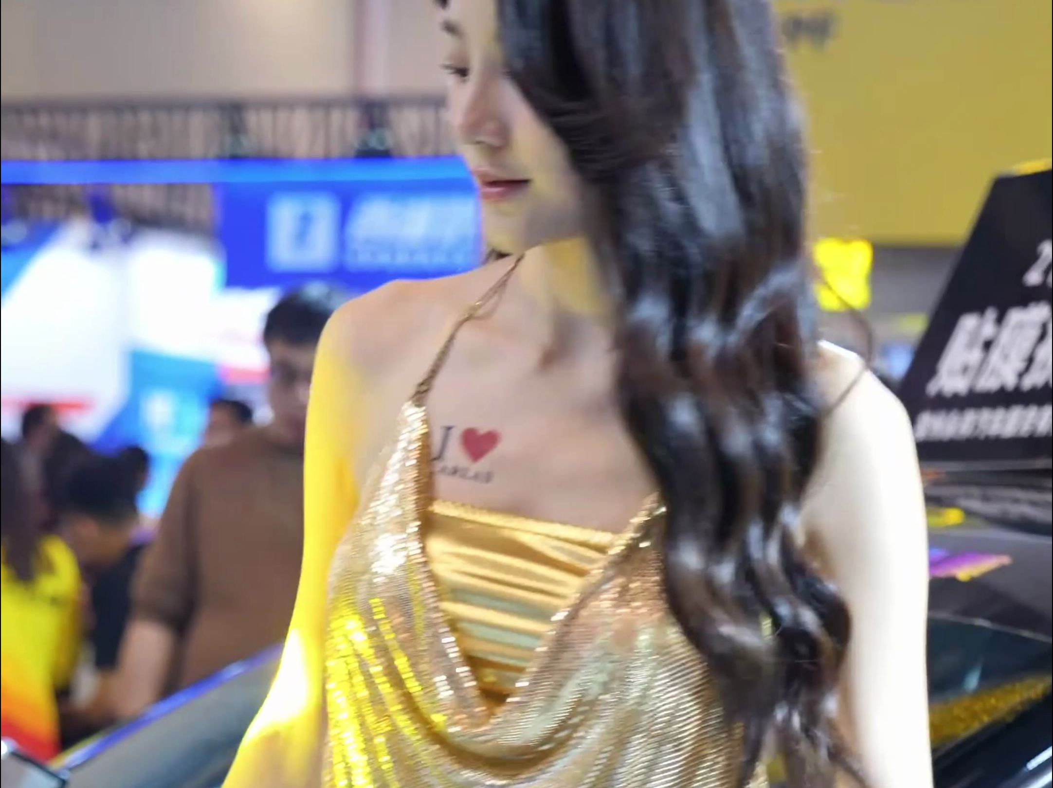 Auto show lady's gold little halter wrap dress outfit