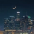 城市夜景灯光 天空中新月月食