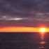 E68 碧波淋漓海面日出日落朝霞晚霞灿烂绯红海水海洋海天相接和谐自然景色空镜头动态视频素材