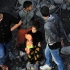 以色列轰炸加沙一难民营 妇女儿童成为巴以冲突最大受害者