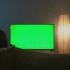 【绿幕素材】女人坐在沙发上看电视，不断切换频道
