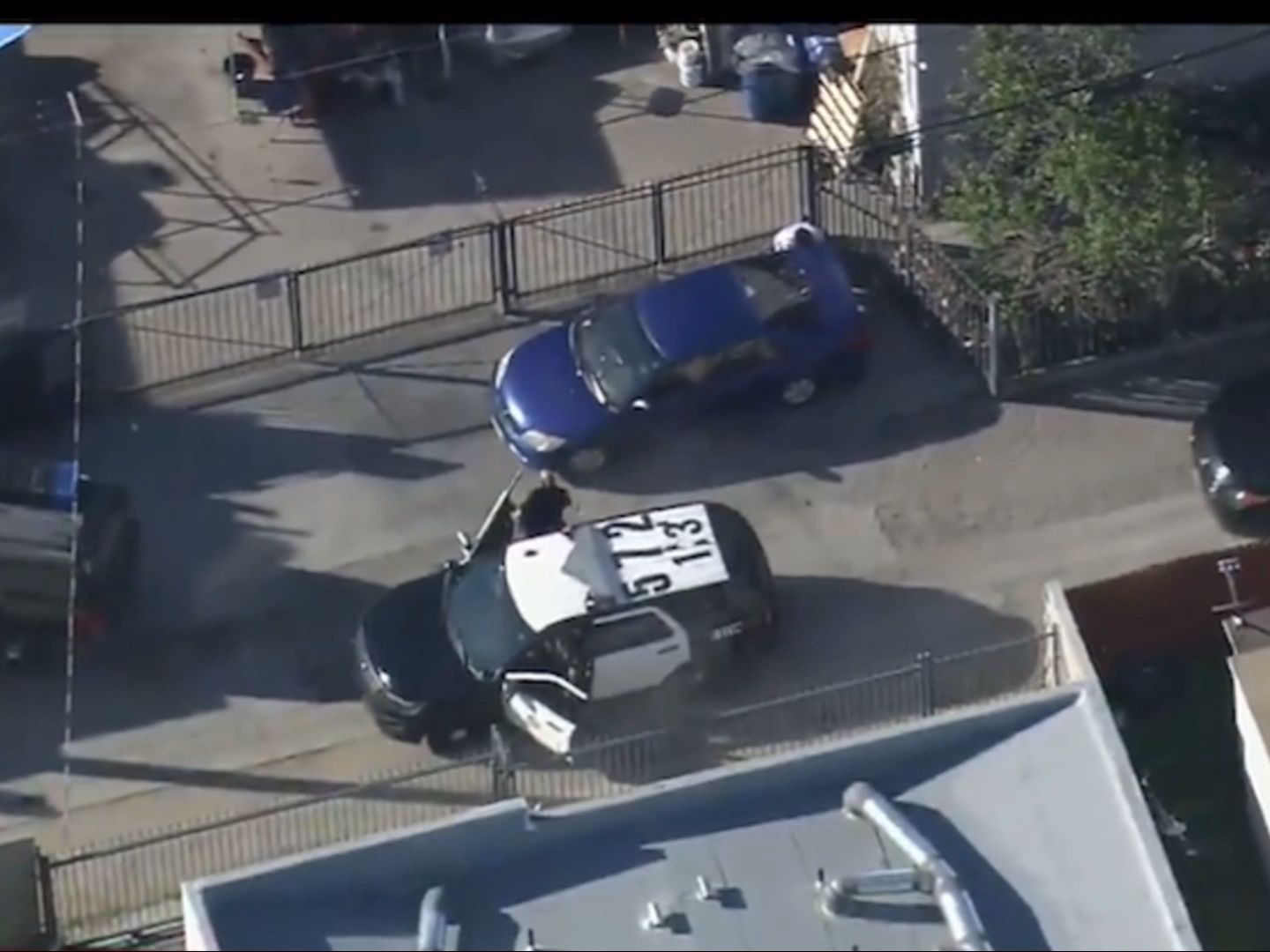 More than a dozen officers, criminals can't be seen.