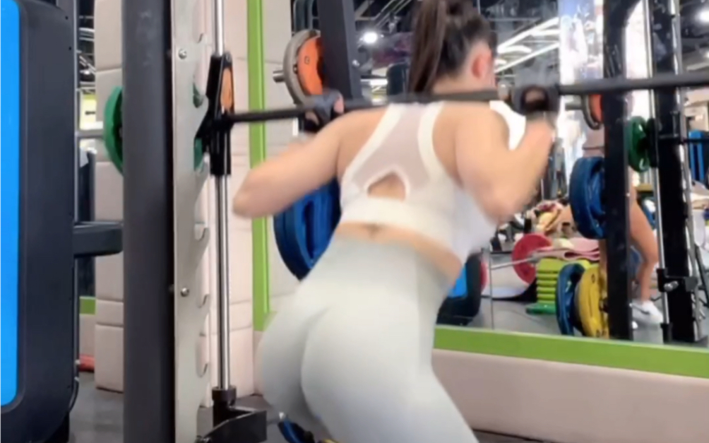 Gym deep squat glute leg workout.