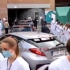 比利时首相访问医院遭医护人员背身抗议
