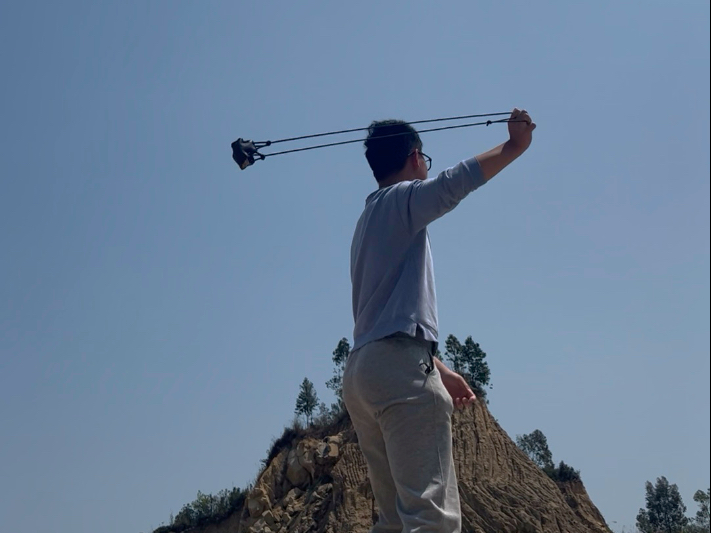 投石索直升机式投法