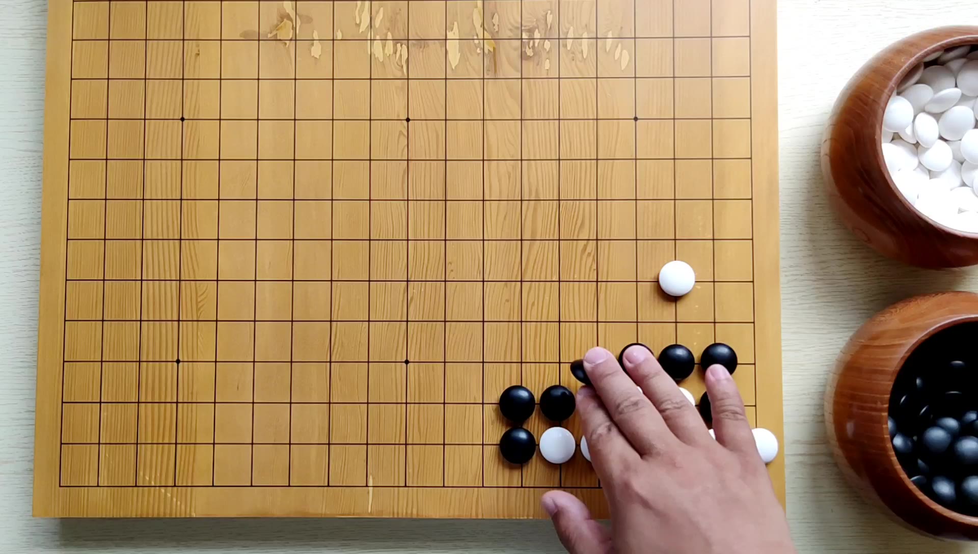 【从零学围棋】围棋:小飞挂点入星位小飞角三三的套路