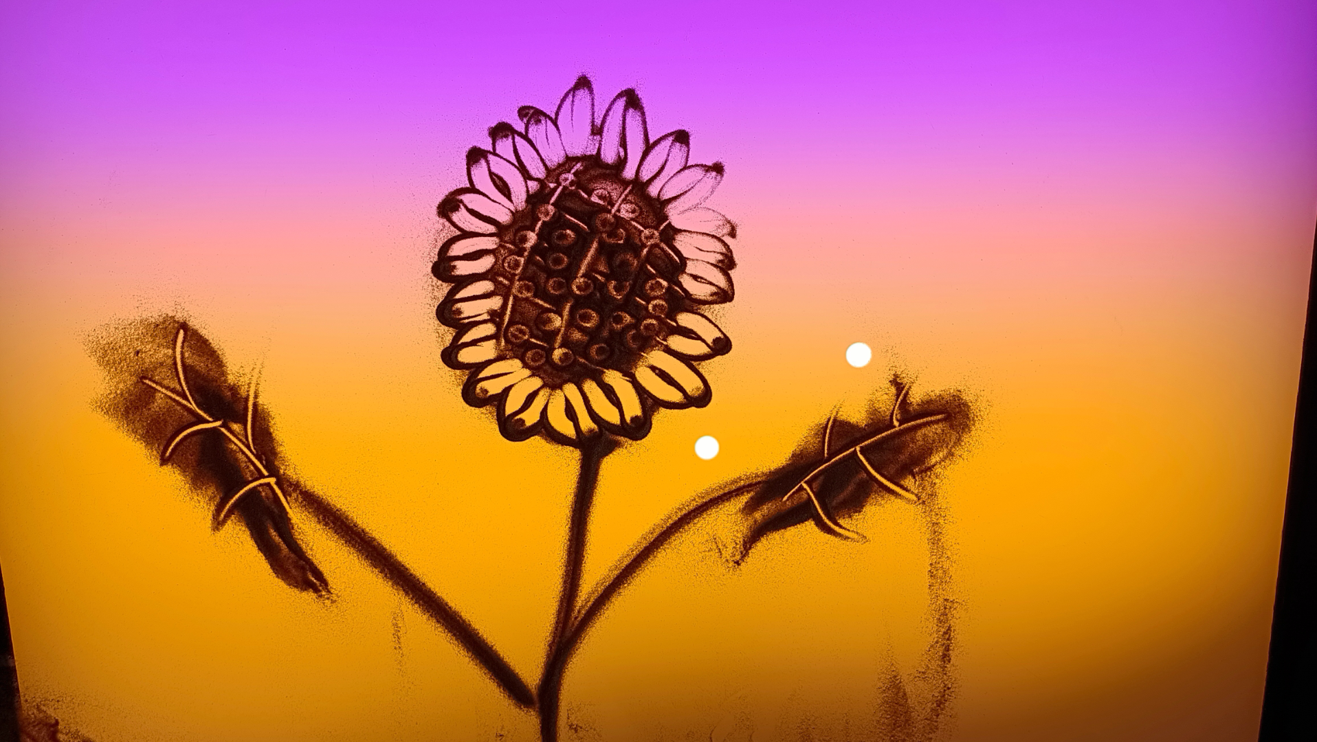 沙画孩子们的作品向阳而生