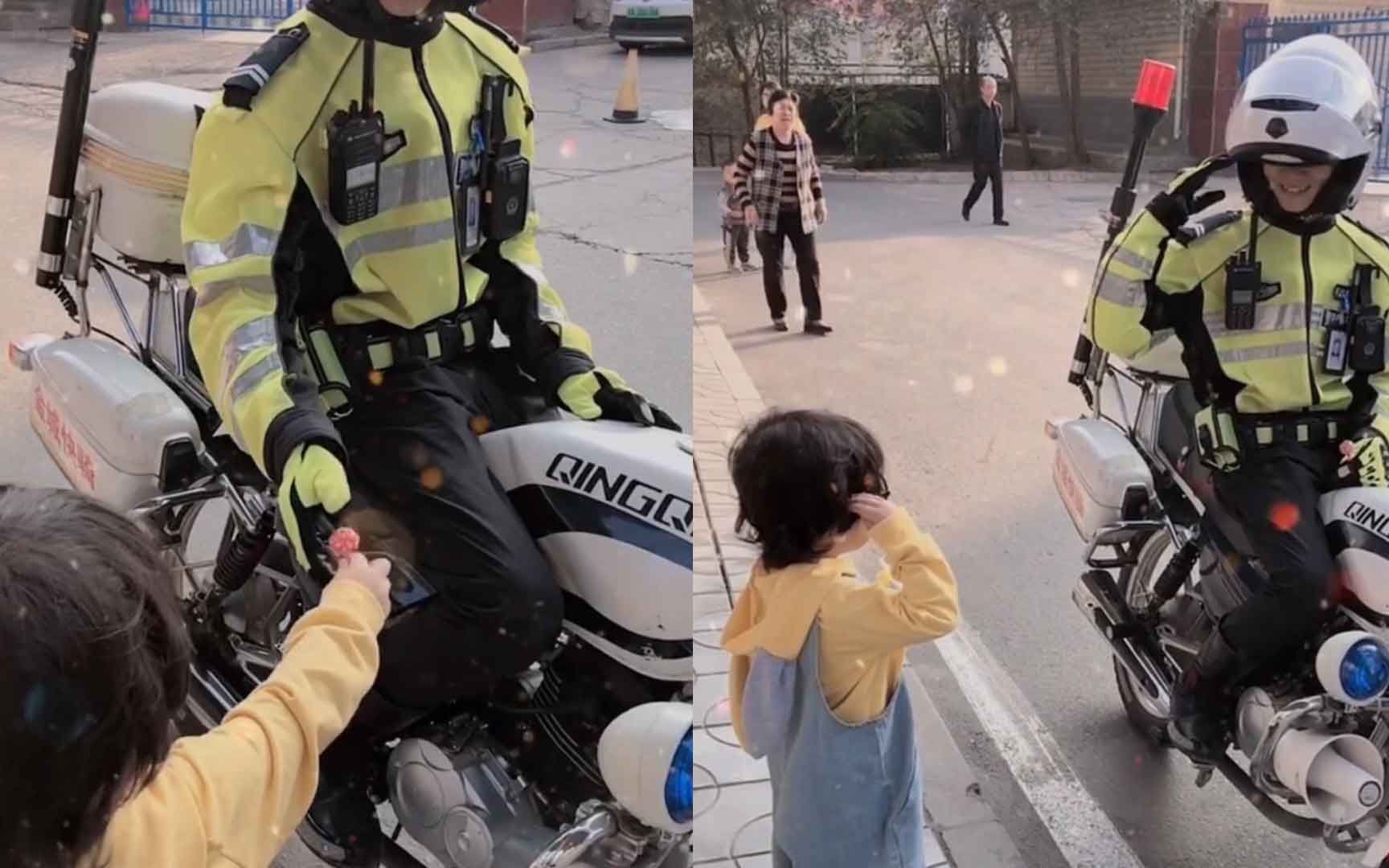 [图]2岁萌娃看见交警叔叔 一路小跑将自己手中棒棒糖递给他还敬了个礼