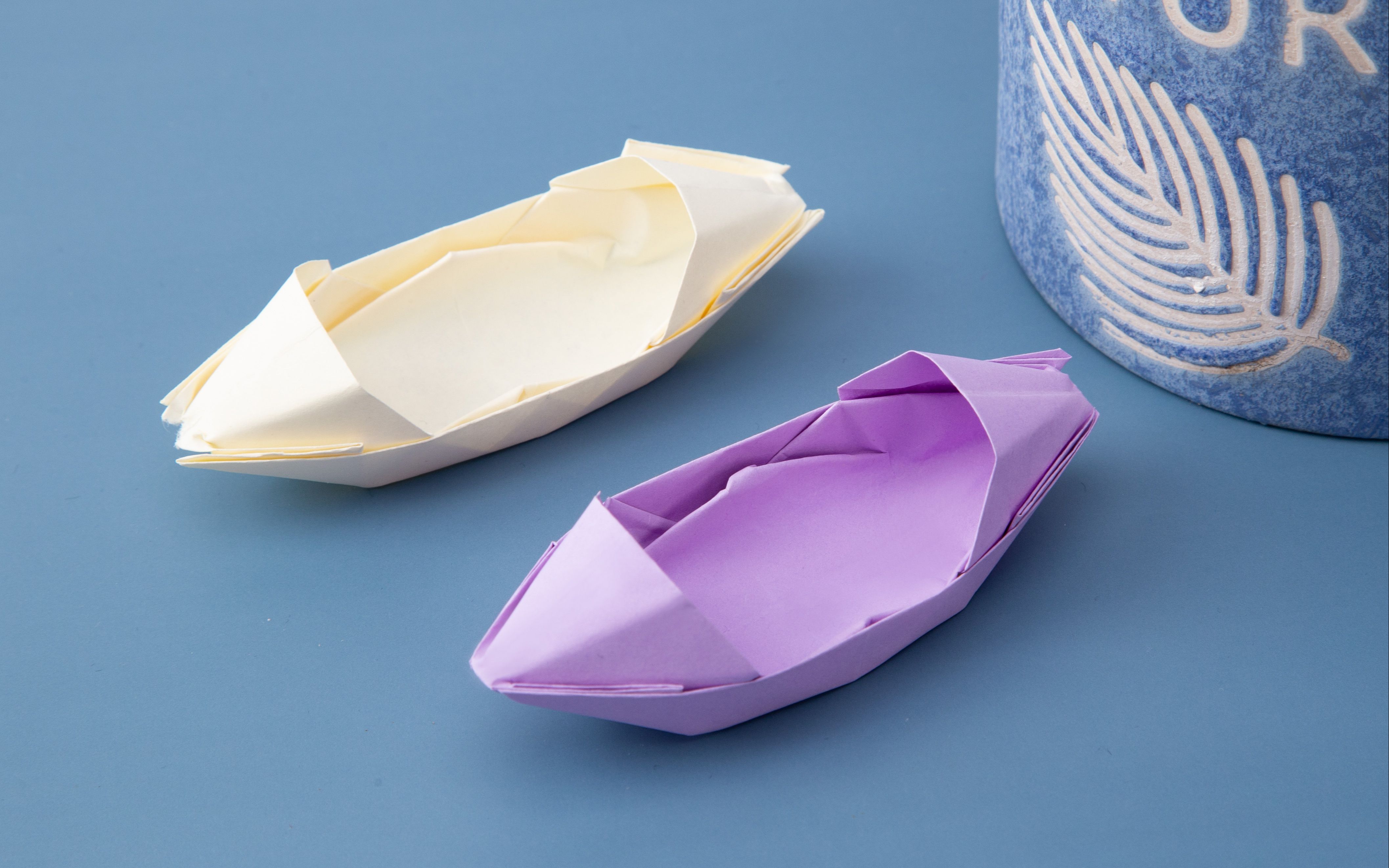 手工折纸小船 两边带遮阳棚的纸船