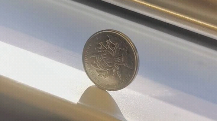 试验:京沪高铁上一元硬币能稳定立起来吗?